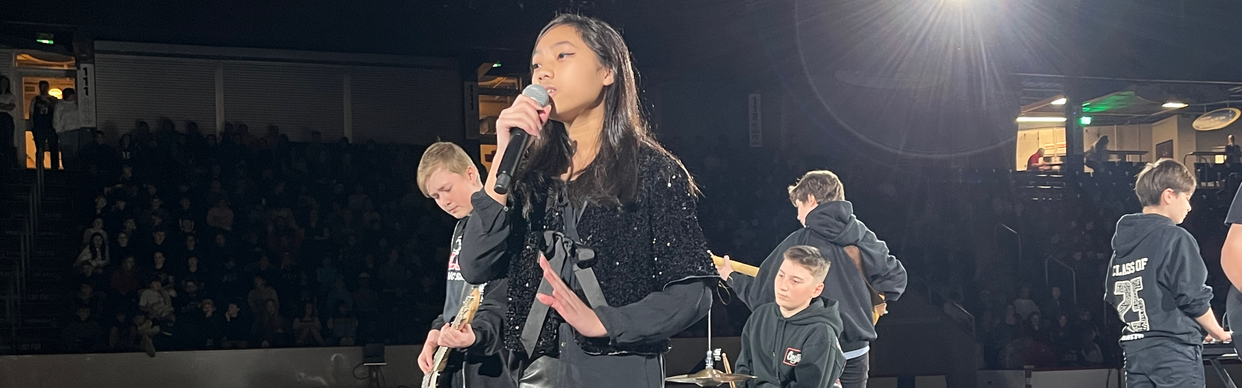 Students perform on stage