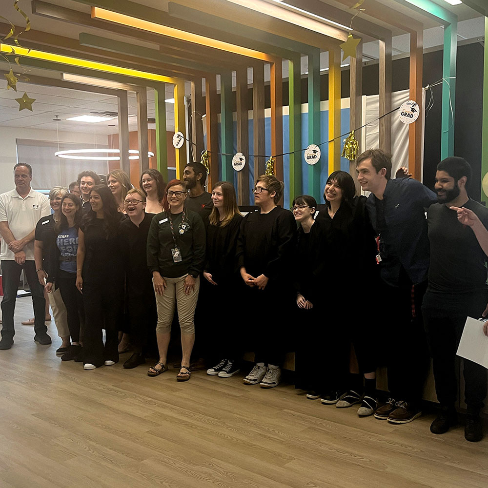 Project SEARCH graduates pose for a photo.