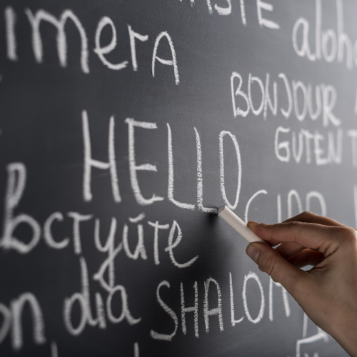 the word 'hello' written on a chalkboard in different languages