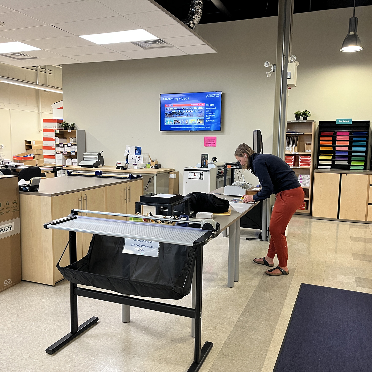 An employee works at a table in the TRJC.