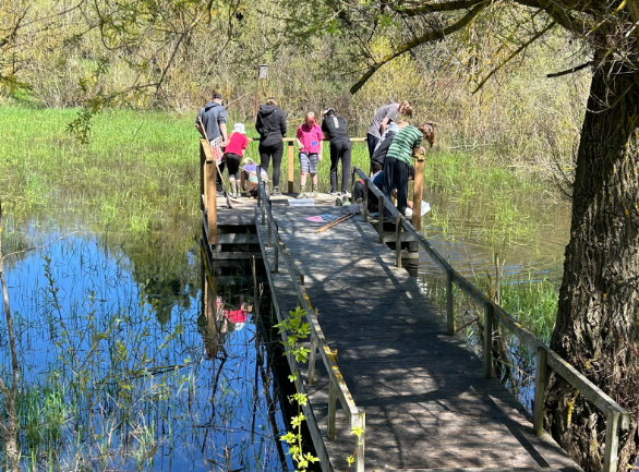 Students are pictured outside by a creek