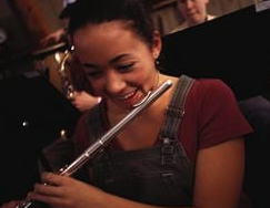 student playing the flute