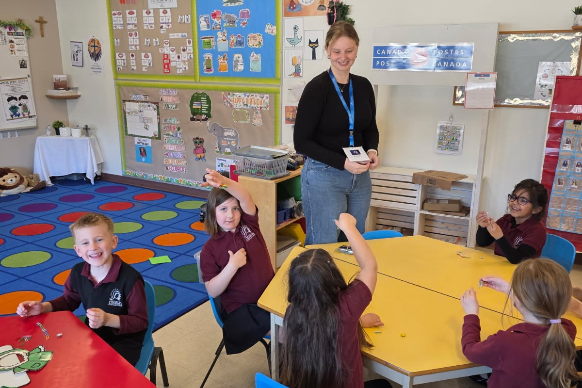 Teacher and student smiling