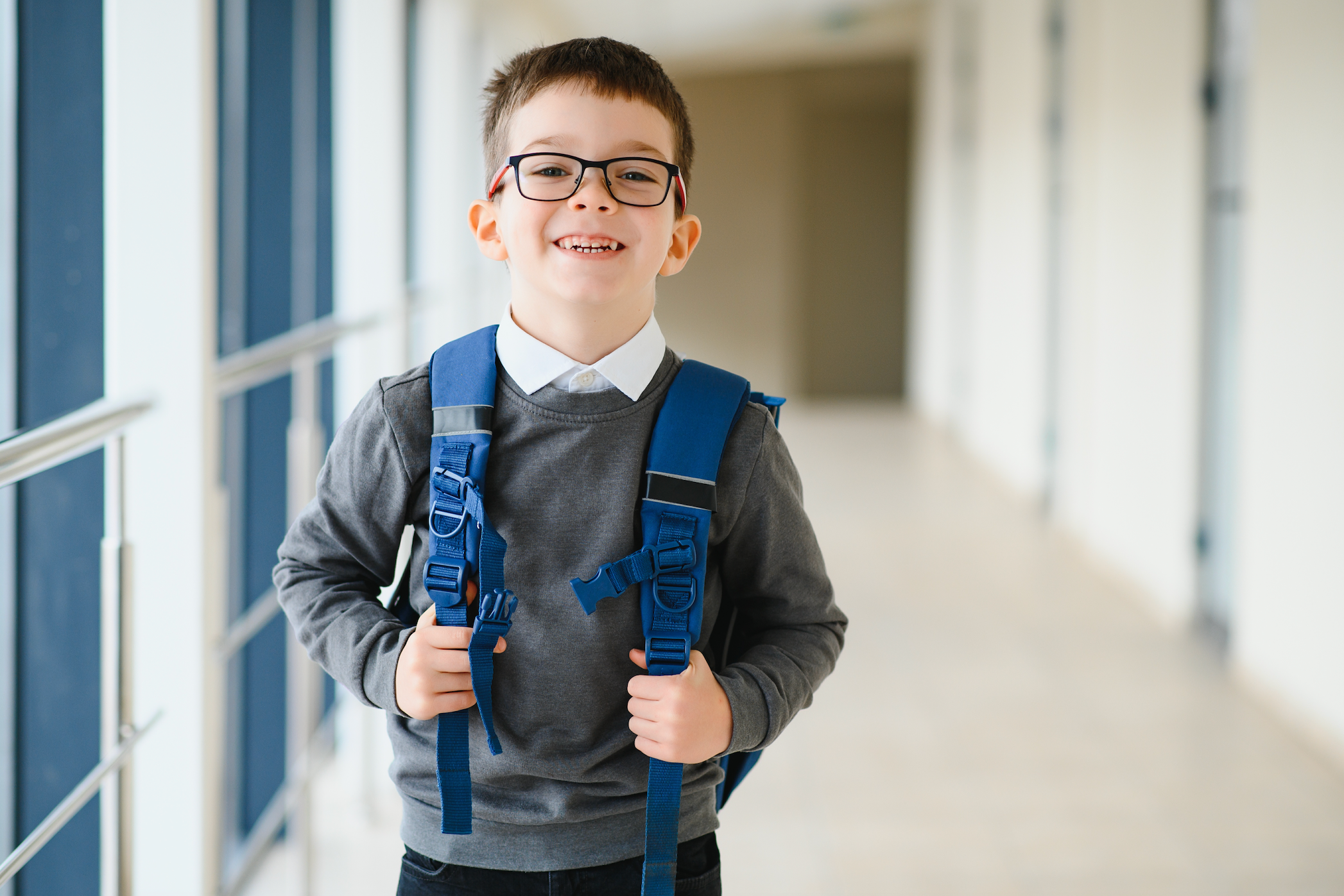 Boy smiling with backpack