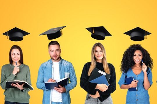 4 people with grad hats