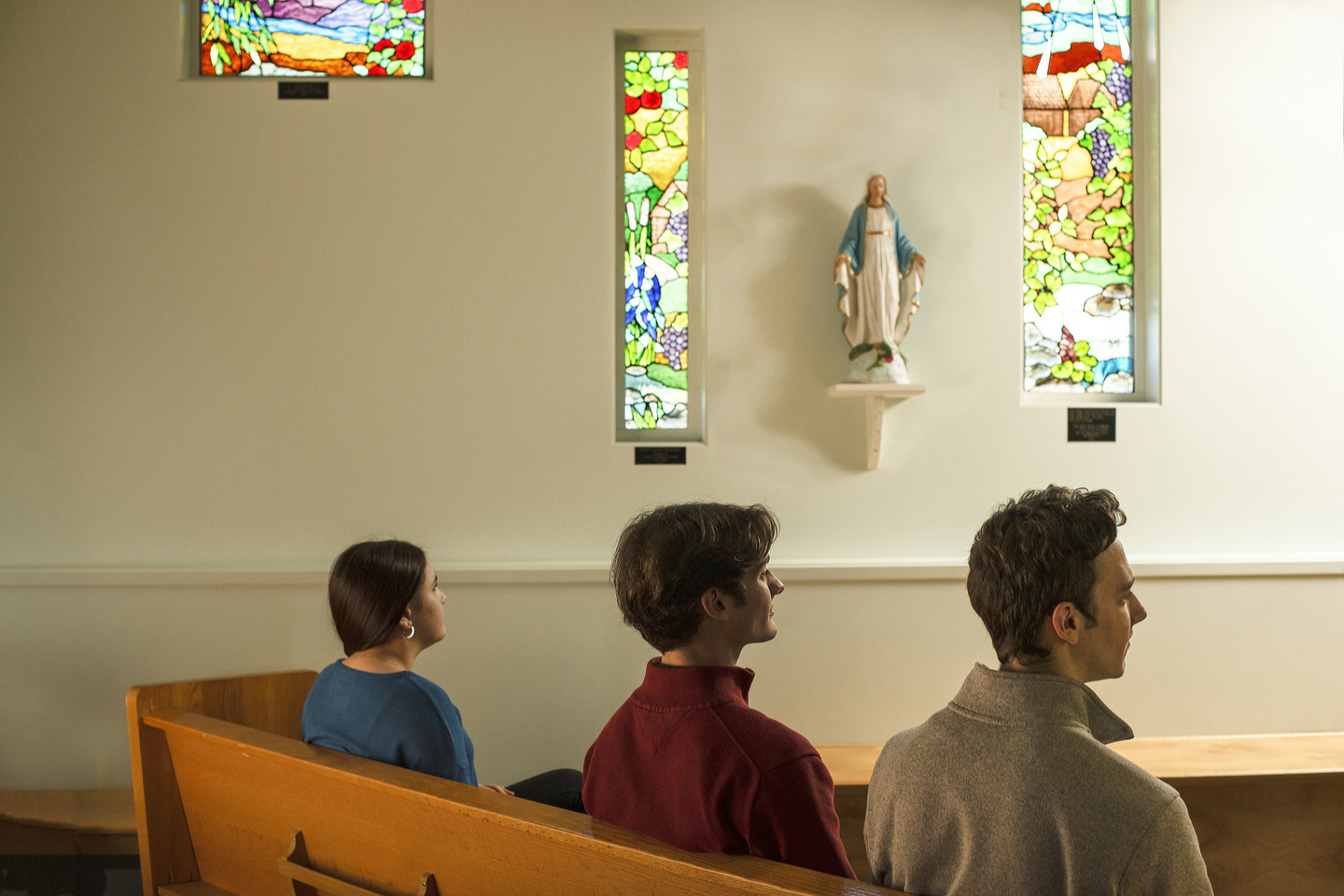 3 students in chapel