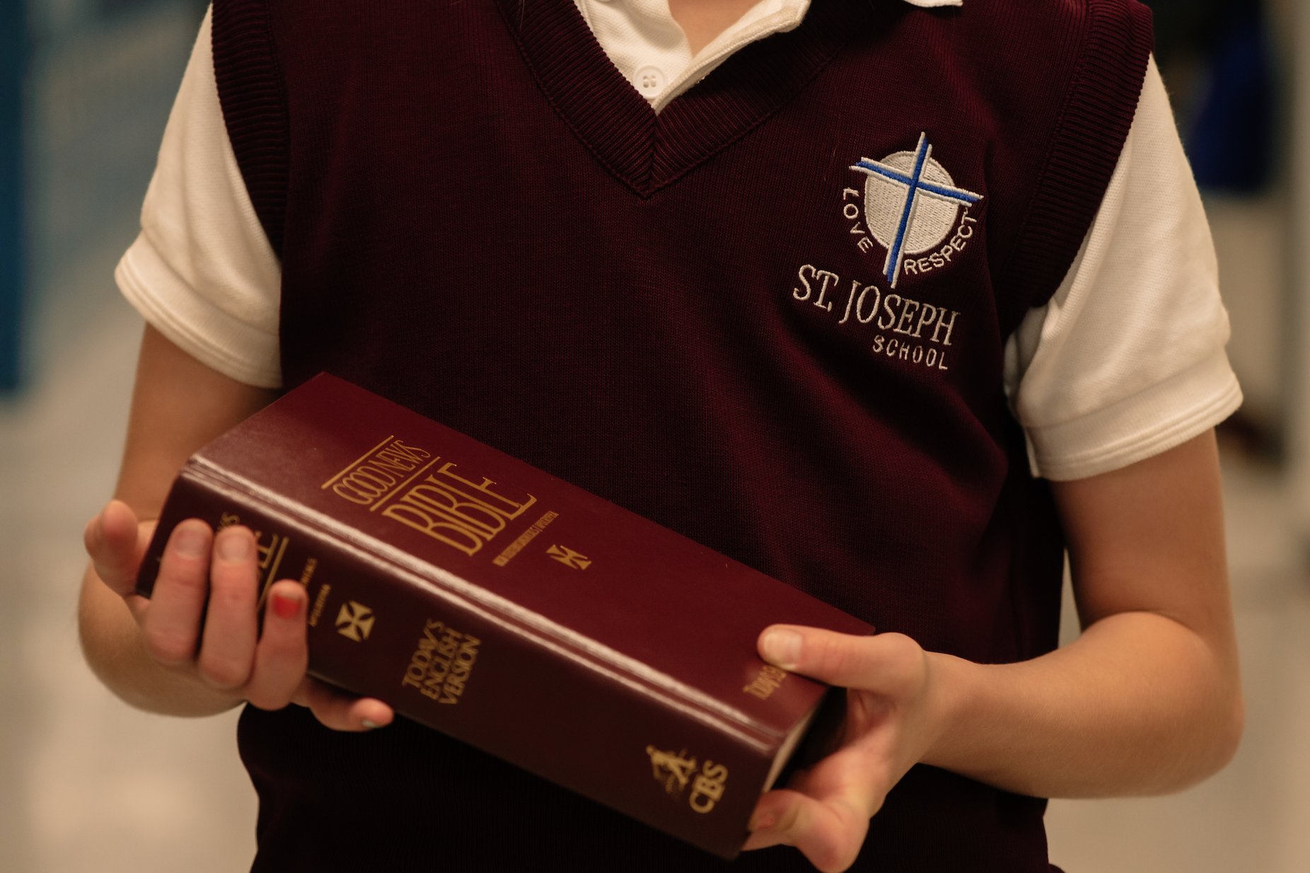 Student holding a Bible