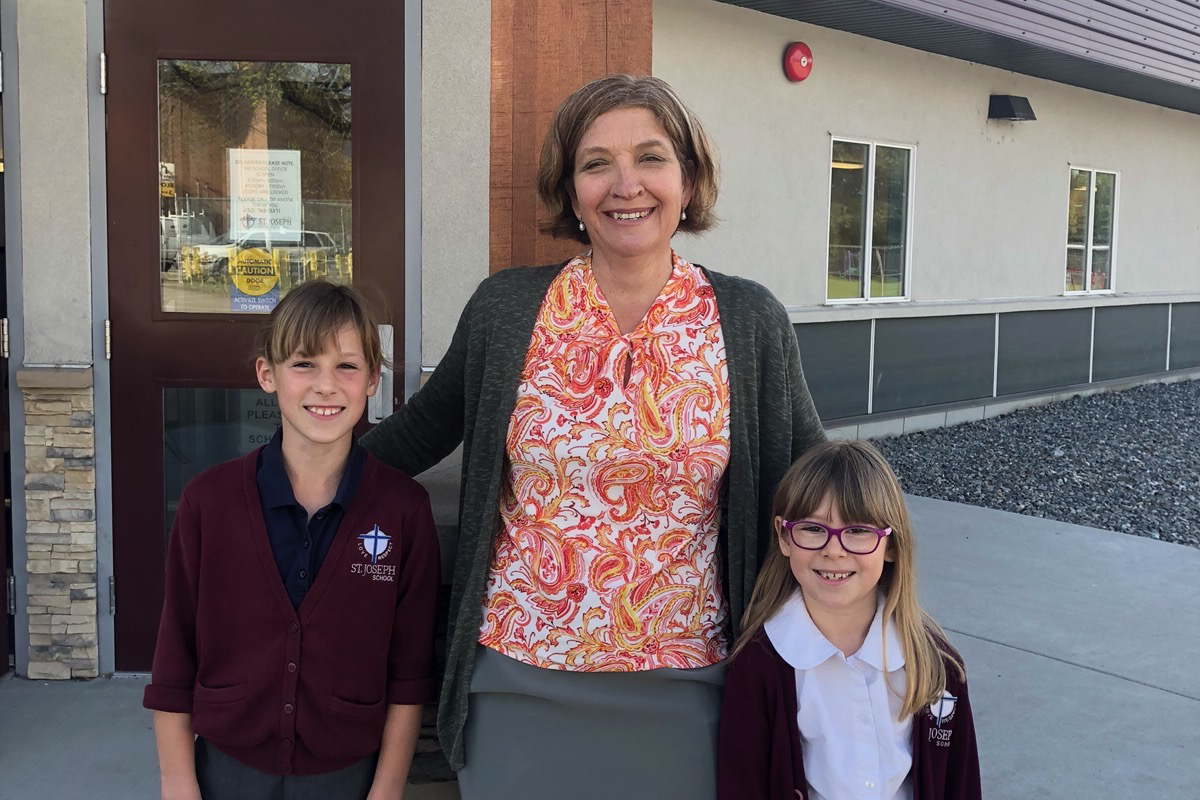 Teacher posed with two students