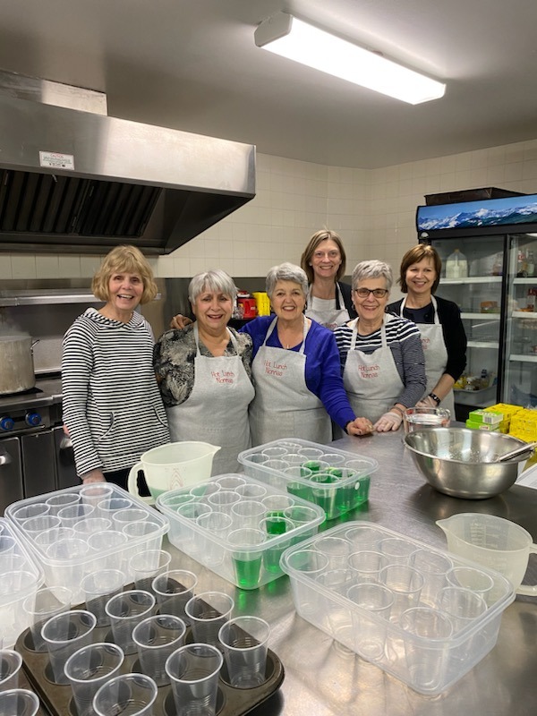 Ladies in cafeteria making lunch