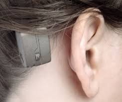 An ear with a hearing aid in it.