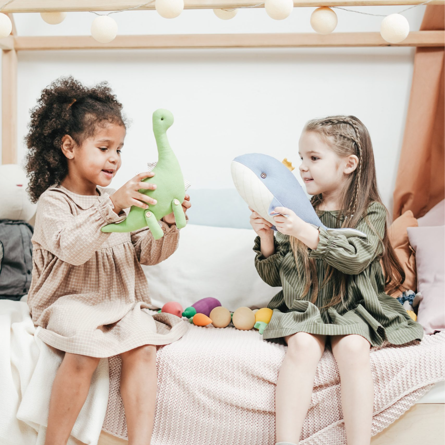 two girls playing with toys