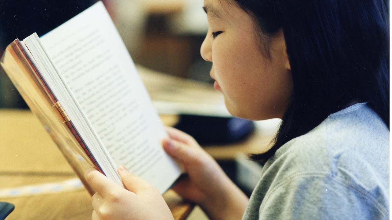 kid reading a book