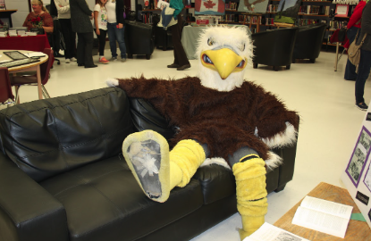 mascot sitting on the couch