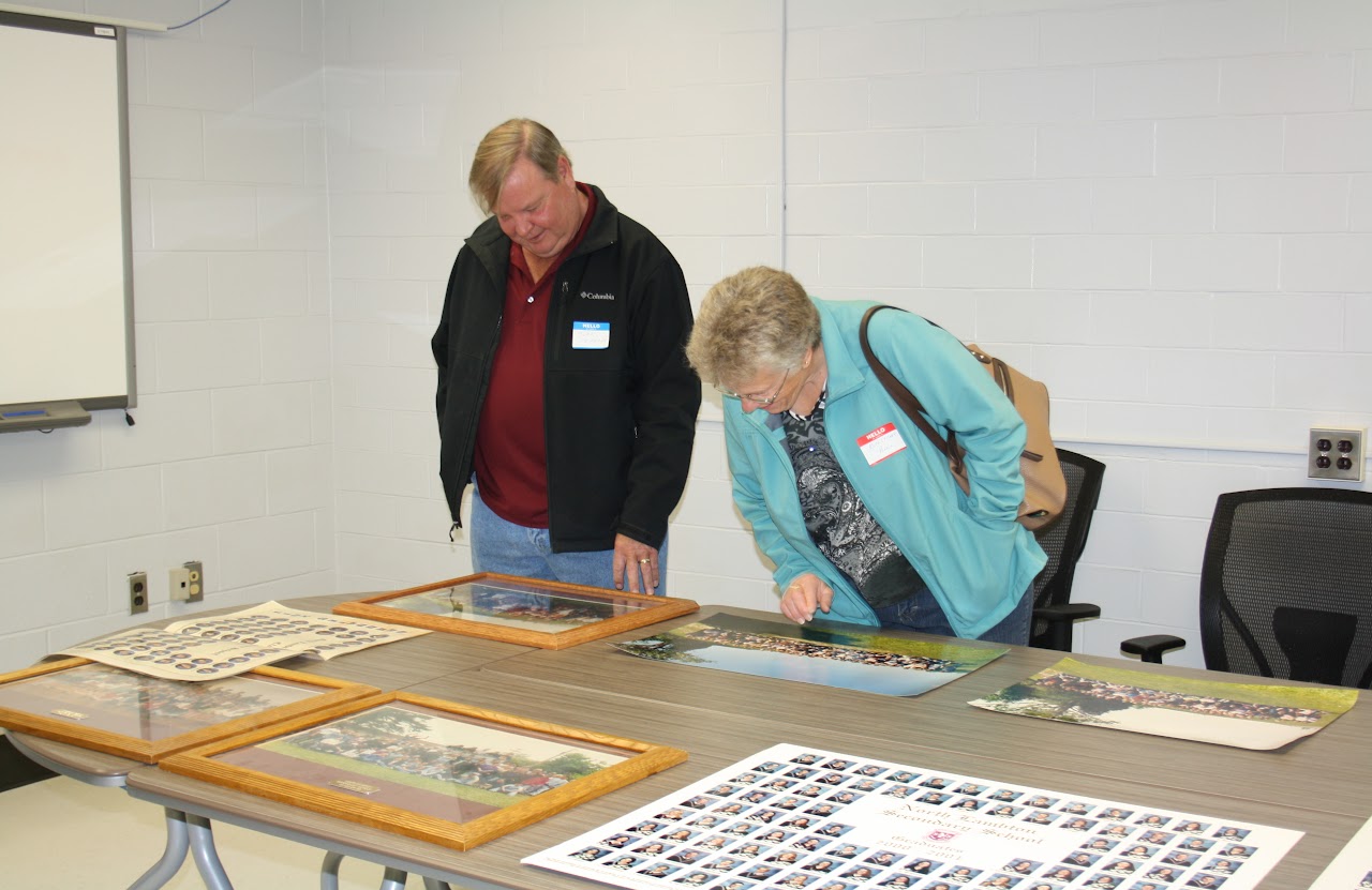 staff members checking out papers