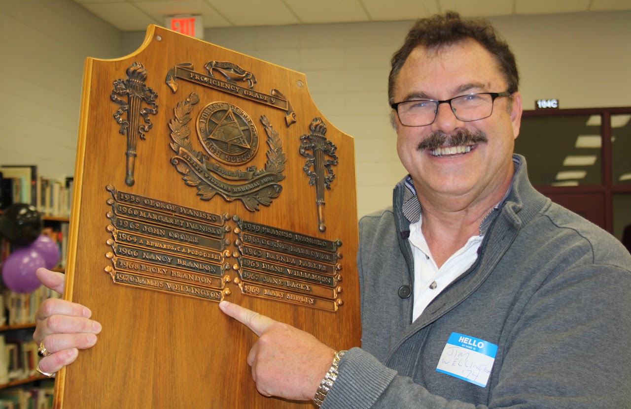 person posing with a recognition