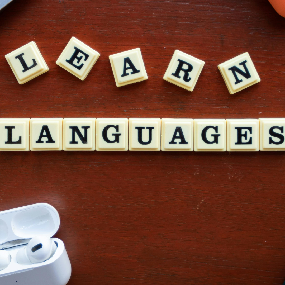 Alphabet tiles spelling out the words learn languages