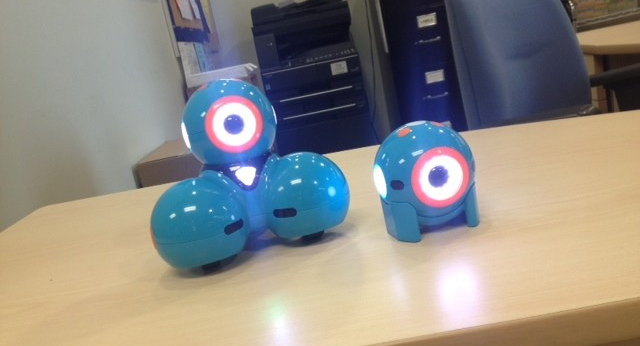 Dash and dot robots sitting on a desk