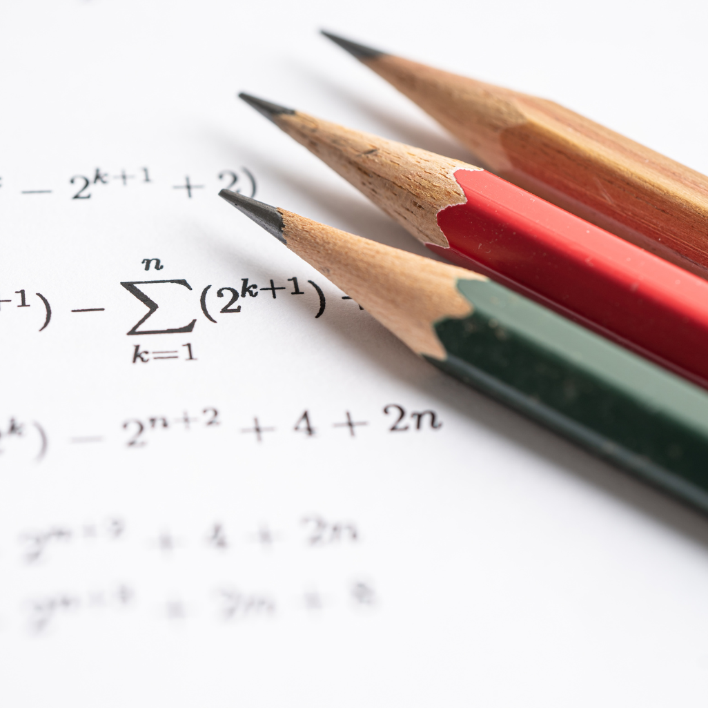 Math equation and 3 pencils
